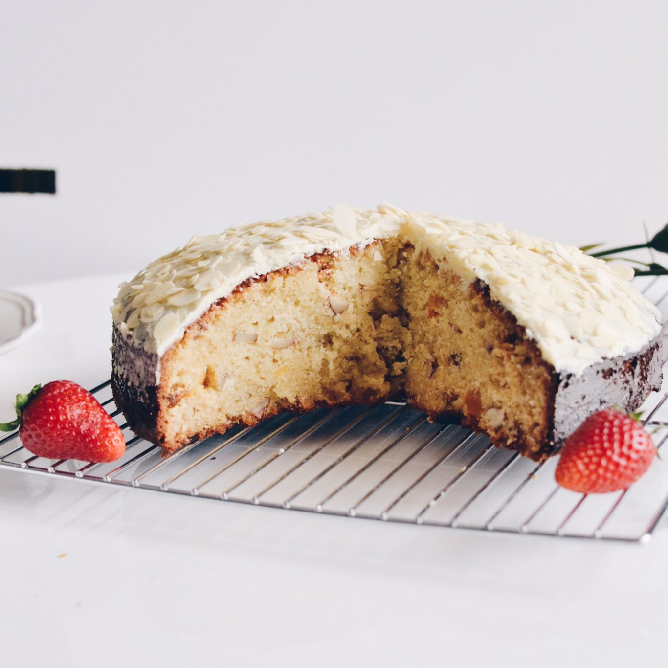 Almond and dried apricots cake covered in white chocolate glaze